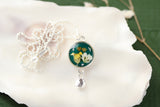 Silver and Dark Green Circle Dangle Necklace with Yellow Flowers